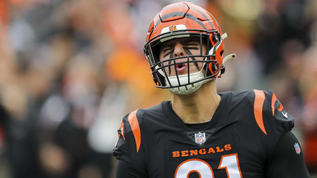 Bengals defensive end Trey Hendrickson celebrates while jogging onto the field before a game vs. the Browns.